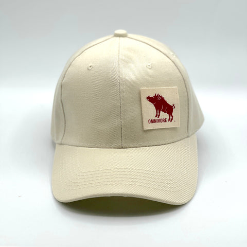 Beige cap with a red wild boar  logo and 'Omnivore' text on a white background
