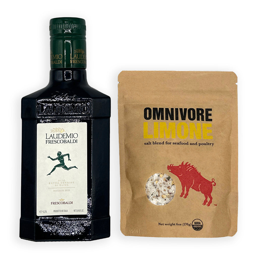 A bottle of Laudemio Frescobaldi olive oil next to a brown stand-up pouch of Omnivore Limone salt blend, displayed on a clean white background.