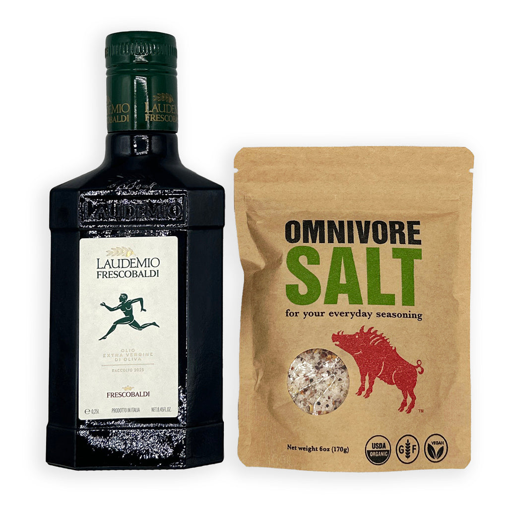 A bottle of Laudemio Frescorbaldi black vinegar next to a brown stand-up pouch of Omnivore Salt seasoning, shown on a plain white background.